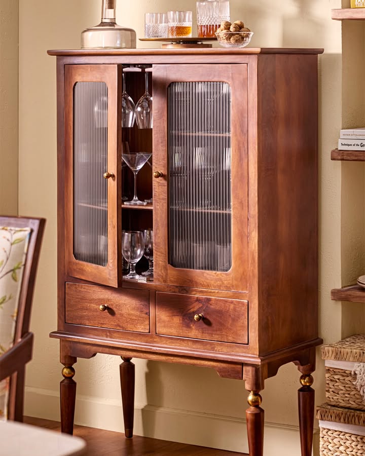 Vintage charm meets modern luxury. A cabinet that holds more than just glassware, it holds moments of indulgence