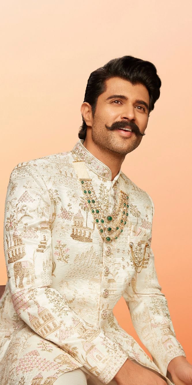 Soft tones, intricate detailing, and a silhouette that feels just right Vijay Deverakonda in this beige Manyavar sherwan...