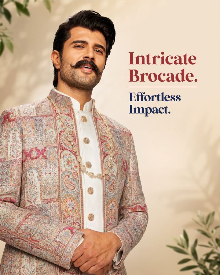 A striking shade of red meets intricately woven brocade for a look that s all about texture, depth, and modern occasion dres...