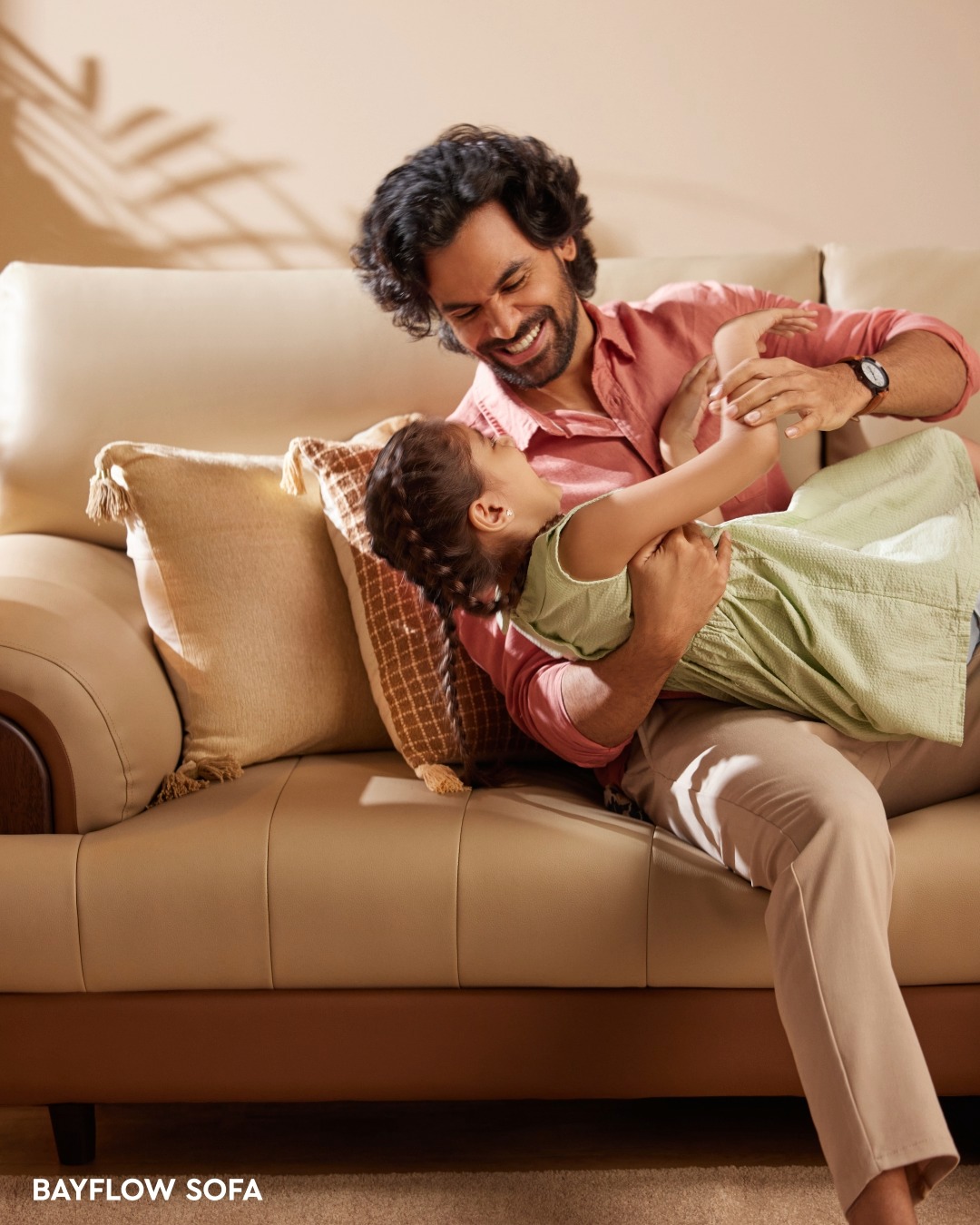 The soft embrace of the Bayflow Sofa holds together a father s gentle smile and a kid s playful hug, creating a space where ...