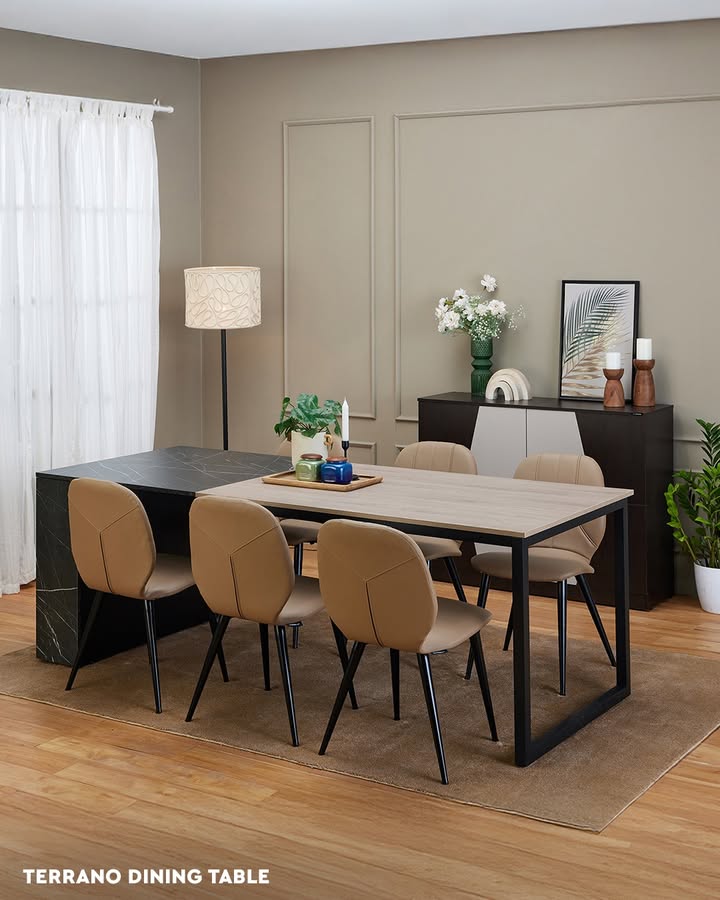 The Terrano Dining Table pairs utility with elegance through concealed storage, a warm wooden top, and the sophistication of...