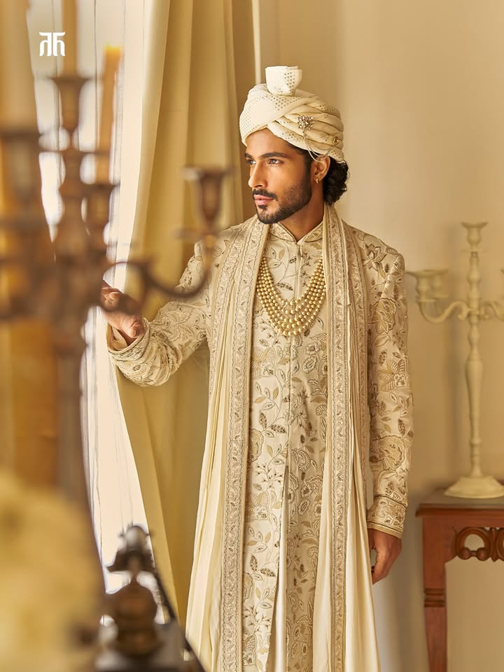 A sherwani that whispers sophistication, not loudness Ivory with gentle gold embroidery