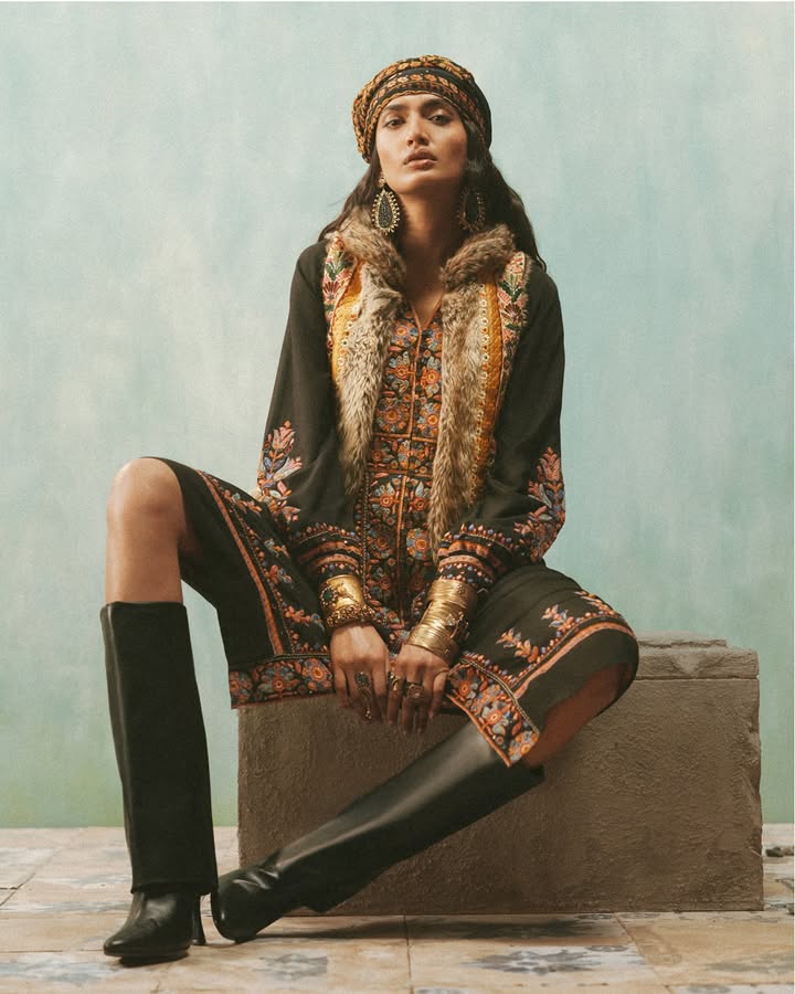An embroidered jacket lined with velvet is paired here with a long dress. Silhouettes in Festive Winter 25 from Ritu Kumar play with texture to create striking looks. Shop now. Jewellery apalabysumitofficial RituKumar FestiveWinter2025 An embroidered jacket lined with velvet is paired here with a long dress