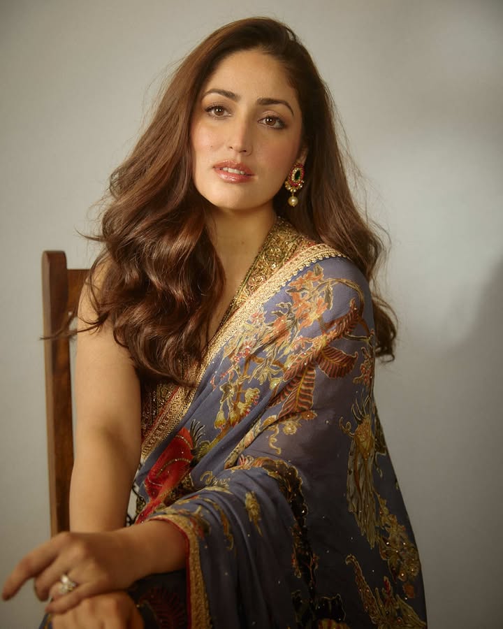 This saree by Ritu Kumar Couture interprets classical botanical elements in muted tones of the earth