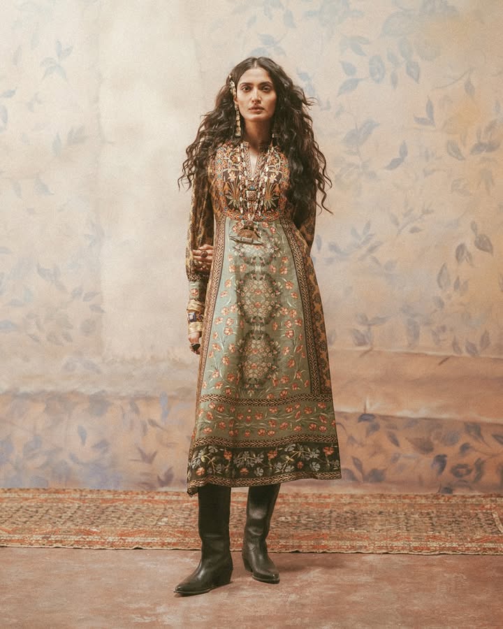 The khaki Albina dress is an A line silhouette crafted in Murshidabad silk, and marked with abstract floral patterns