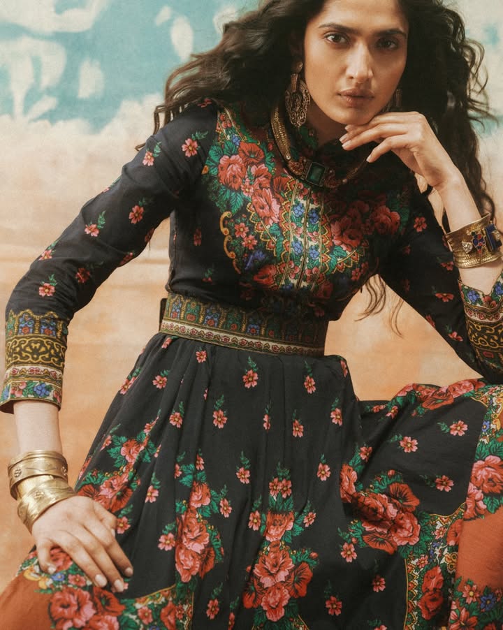 The black Amama Anarkali dress, featured here, is printed with a floral pattern on a canvas of cotton