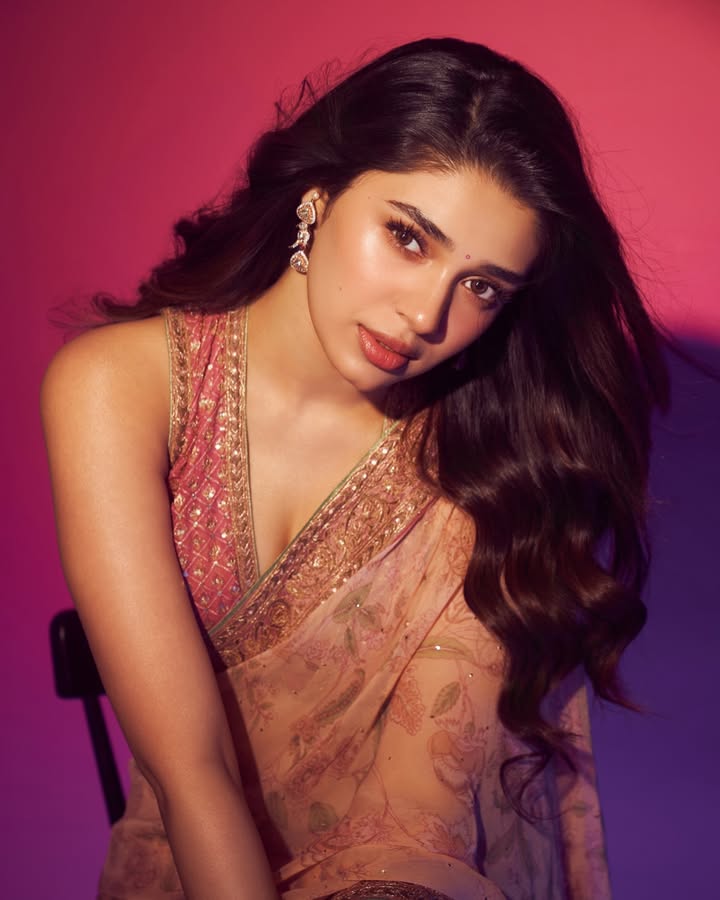 The Nandi Saree by Ritu Kumar Couture features botanical motifs and a delicately embroidered border in pastel shades of pink...