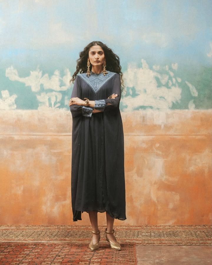 Classic Ritu Kumar motifs adorn the neckline and cuffs on this indigo dress