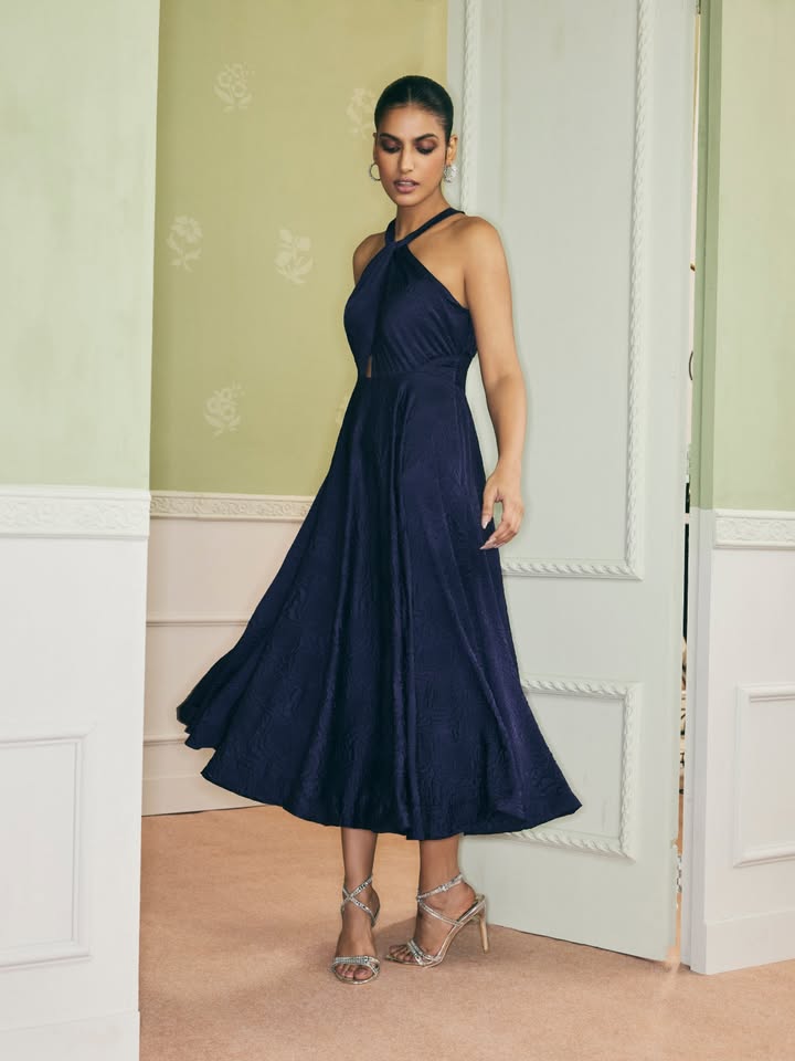 Spun in satin, dresses from our latest collection shine on the dance floor. Shop No Reservations, online and in store