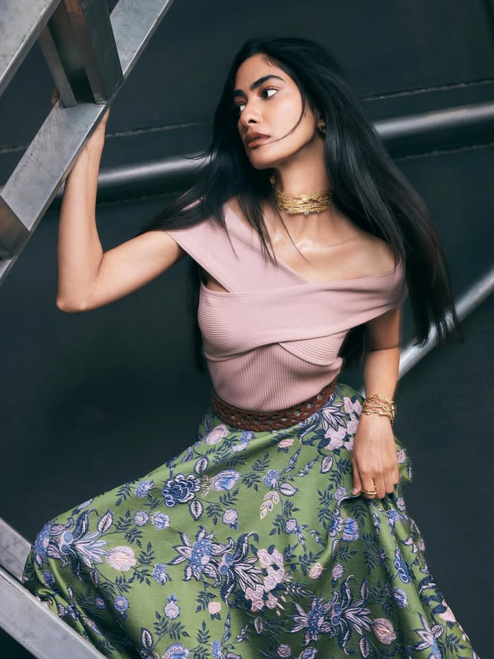 An elevated basic with a sculptural edge. Our beige knit top is designed to contour, wrap and move with you