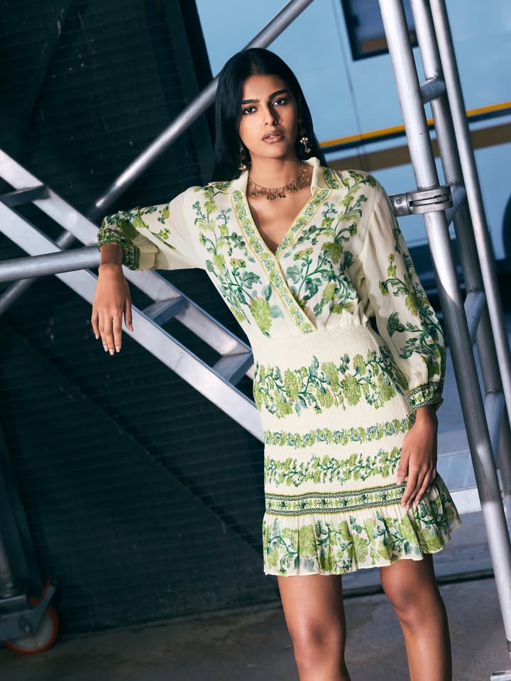 The Florica mini dress pairs drifting florals with a defined smocked silhouette