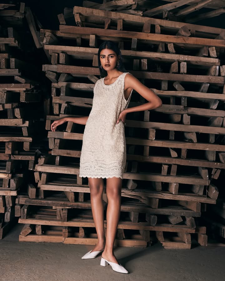 Delicate lacework, cut into an easy shift dress