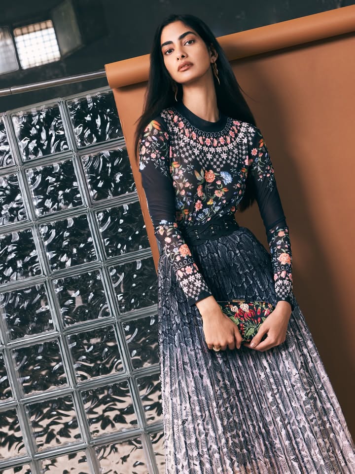 A play of florals and sheer texture, brought together in a silhouette that moves beautifully