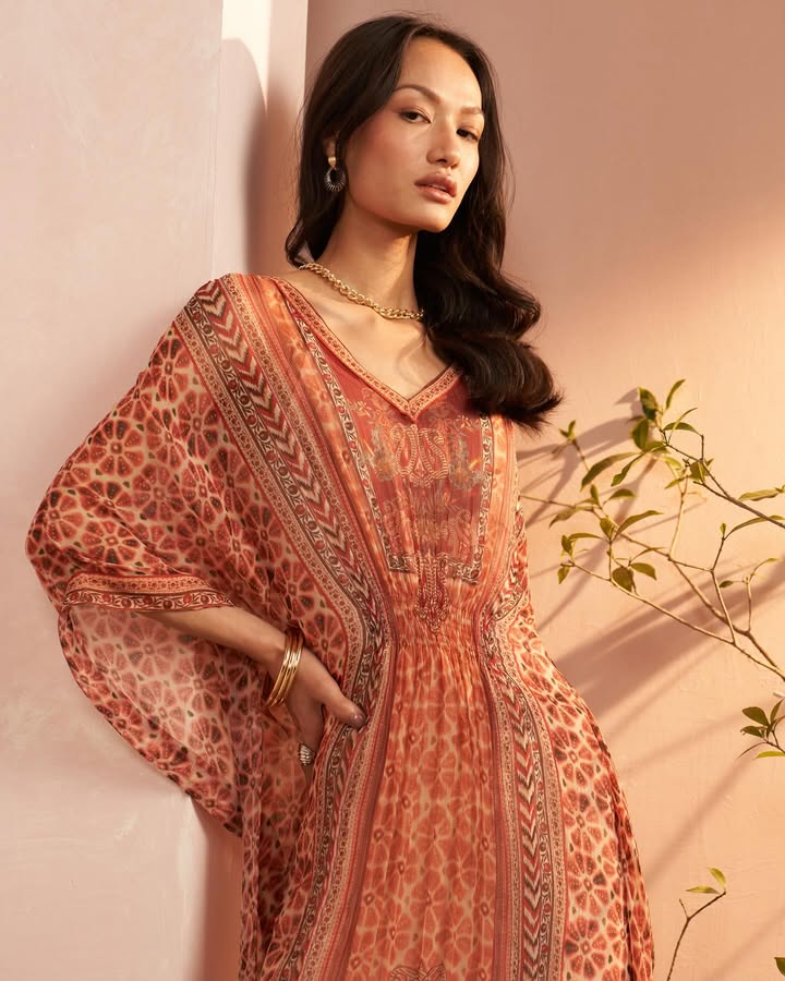 Like a garden in bloom this floral chintz kaftan is made for sunlit days and slow summer moments