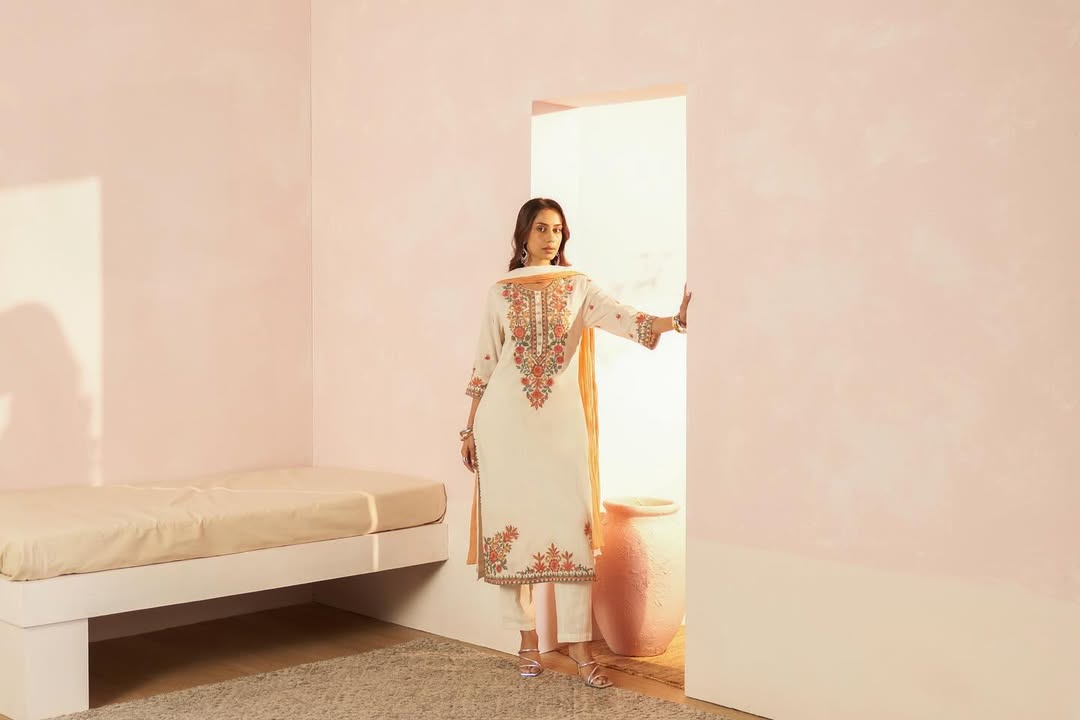 A classic white moment in breezy Kota Doria, detailed with delicate embroidery. Explore the collection online in stores