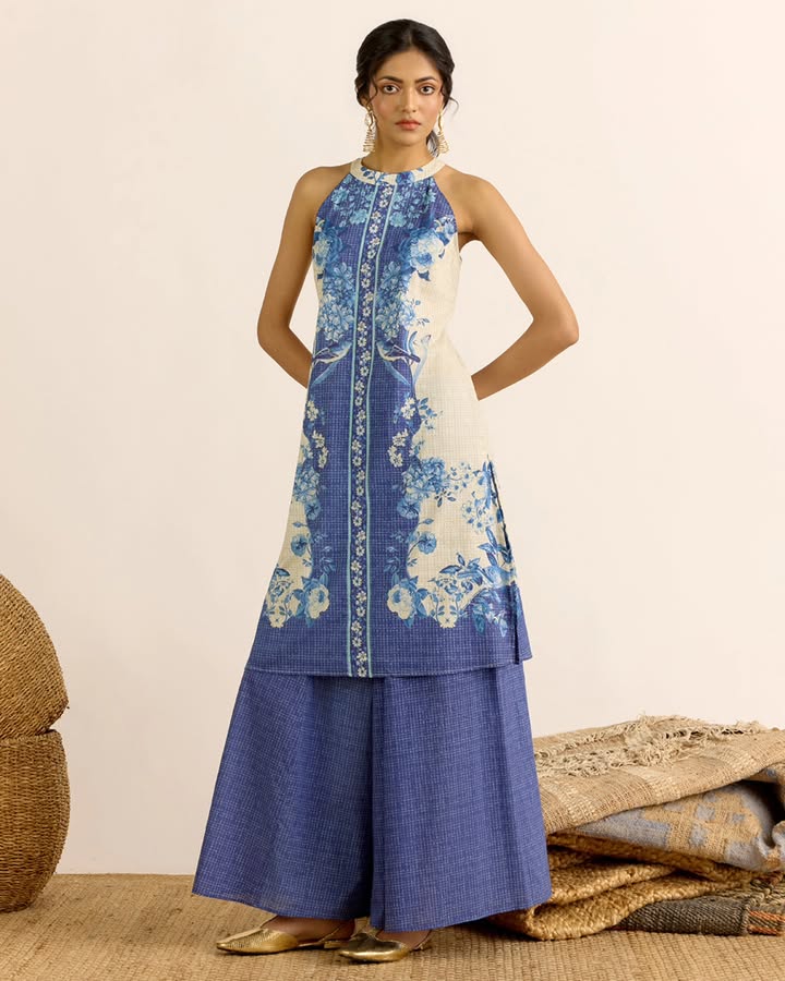 A sleek halter neck kurta set in breathable 100 cotton for effortless summer dressing. AarkeSS26 AarkeNewCollection