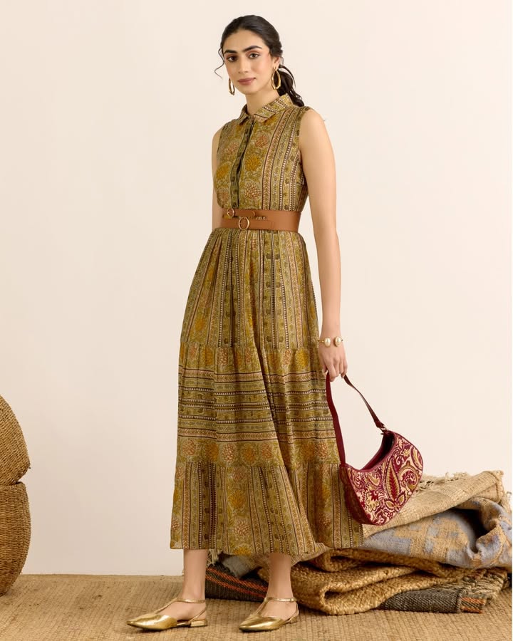 The Toobah Long Dress from the AARK SS26 collection comes in a rich olive tone with soft movement and an easy silhouette