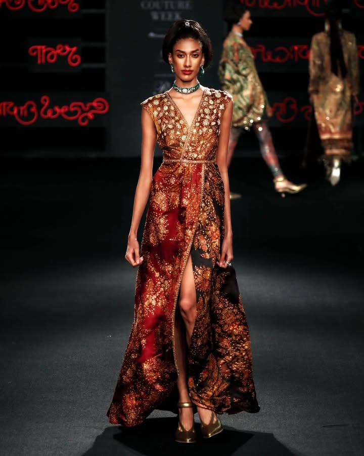 A botanical print is embellished with aari tikki and zardozi medallions on this contemporary silk satin dress