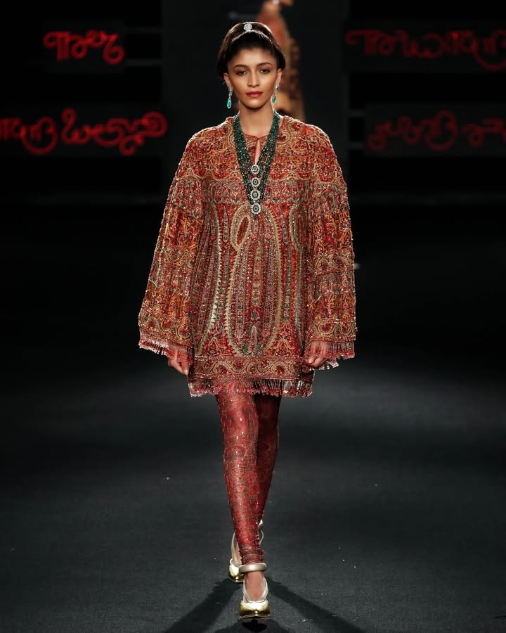 A flat dupion dress that draws from ancient Kashmiri jamawar techniques is playfully highlighted here with classic Ritu Kuma...