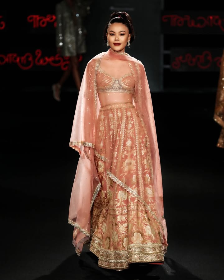 A silk chinon lehenga is paired here with a silk blouse and a netted dupatta