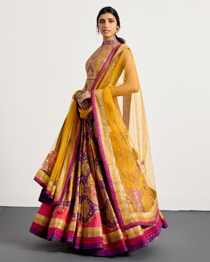 In a play of contrasting colors, the Morina lehenga set pairs dramatic flair with optimism and joy
