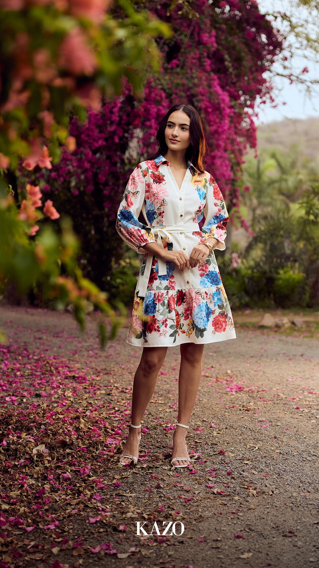 The LAPIN Mini Dress is a vibrant floral piece with a crisp white base and multicolour prints, blending femininity with effo...