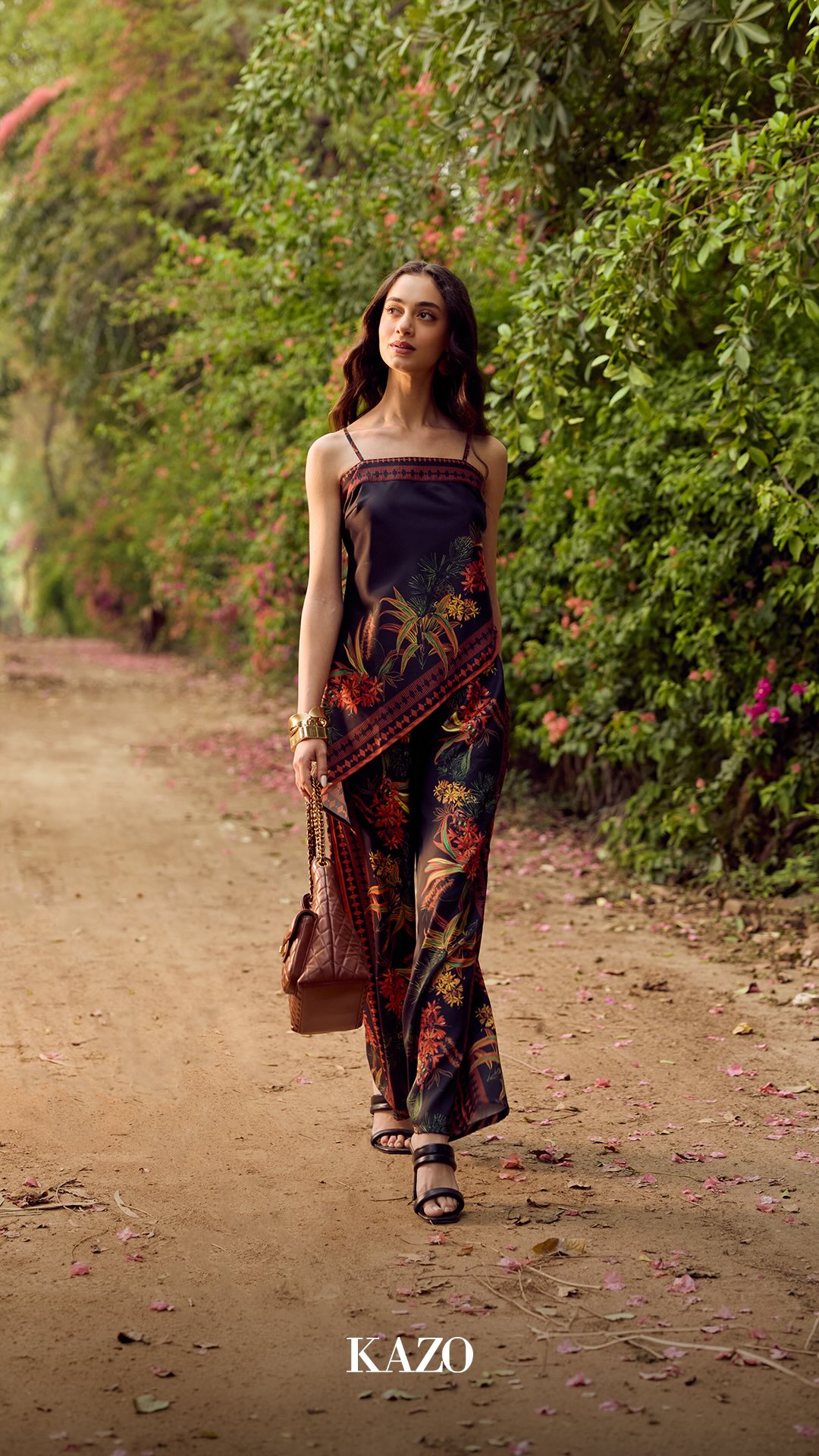 The Robinson Printed Strappy Co ord Set is crafted from sleek satin finish fabric, highlighted by a vibrant tropical border ...